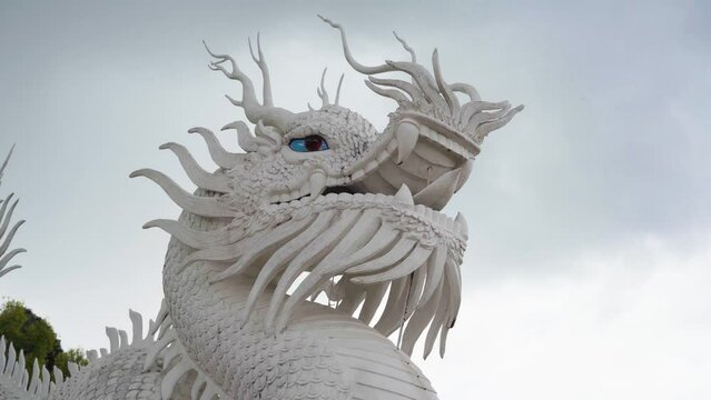 dragon of the stairs of the big white buddha of chiang rai, thailand