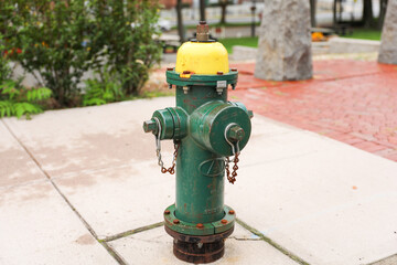fire hydrant on urban street corner, ready for action amidst city life. Symbol of safety, preparedness, and community vigilance