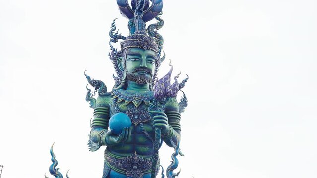 warrior sculpture at the gate of Wat Rong Suea Ten - blue temple of Chiang rai, thailand