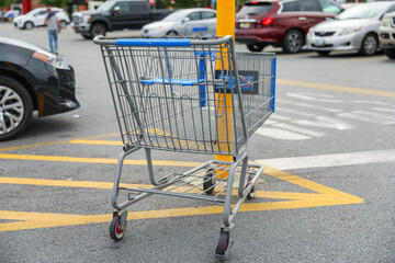 shopping cart overflowing with goods, symbolizing consumerism, rising prices, and the impact of...