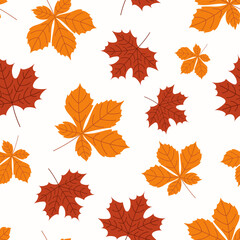 Seamless autumn pattern with red and gold leaves on a white background
