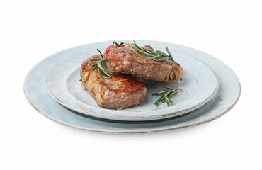 Plate of delicious fried meat with rosemary and tomato isolated on white