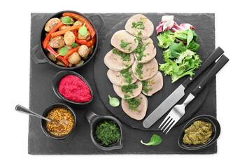 Tasty beef tongue pieces with salsa verde and ingredients isolated on white, top view