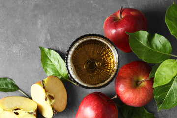 Flat lay composition with delicious apple cider on gray table