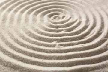 Beautiful spiral on sand, closeup. Zen garden