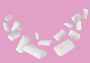 Many chewing gum pads falling on pink background