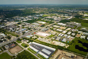 Aerial view of industrial park with goods warehouses and logistics centers in city zone from above