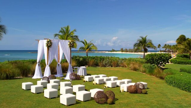 Beautiful wedding arch beach, Nassau, Bahammas, Paradise Island. Beautiful romantic marry ocean resort. Sunny, No people, drone footage. Wedding ceremony decor arch outdoor. High quality 4k footage