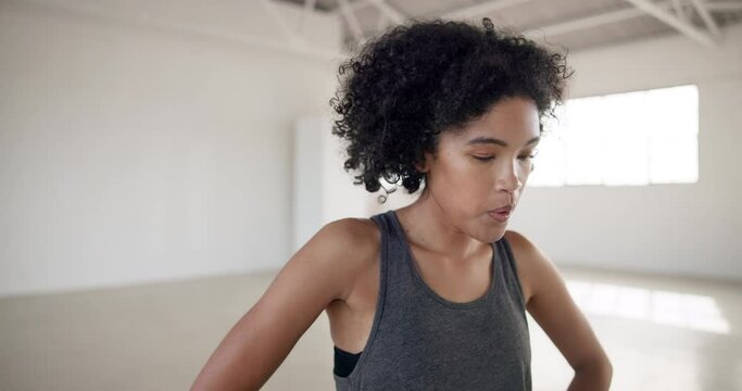Fitness, breathing and woman tired of exercise and training performance in empty dance studio or school. Wellness, workout and person with body fatigue after competition, rest and cardio break