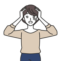 頭を抱える女性
