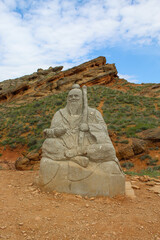 The guardian statue of the elderly teacher at mountain Big Bogdo Russia