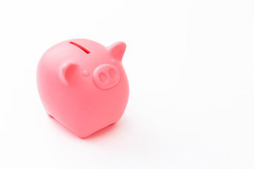 白背景にブタの貯金箱