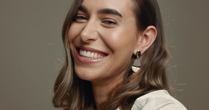 Fashion, beauty and face of woman laughing in studio on grey background with natural confidence and pride in style. Gen z, model with cosmetics and portrait with happiness, skincare glow and makeup
