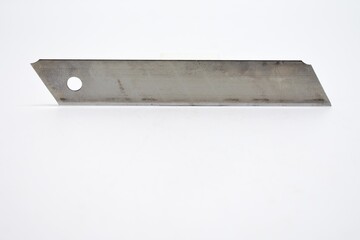 This large sized silver colored cutting knife made of metal is photographed on the isolated white background