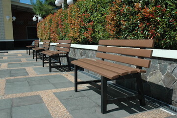 A row of wooden benches that adorn the garden