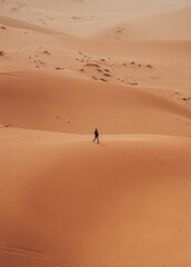 Incidental local berber man wandering through Sahara Desert Merzouga, Morocco