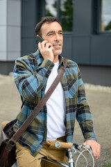 Confident stylish businessman talking on smartphone