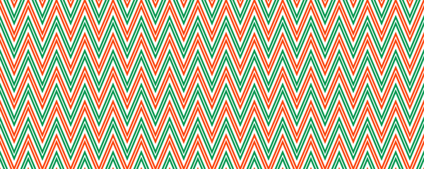 Red and green seamless pattern. Candy cane zigzag stripes background. Christmas repeating decoration wallpaper. Winter holiday lines backdrop. Xmas peppermint gift wrapping print. Vector