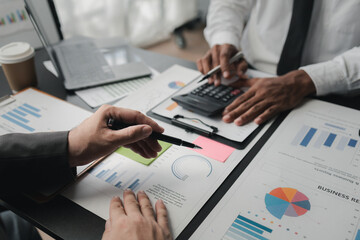 In a meeting between the finance and marketing departments to discuss work plans, two startup employees are brainstorming ideas for a profitable operating plan. Planning meeting concept.