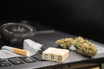 preparation of a cbd marijuana joint on work