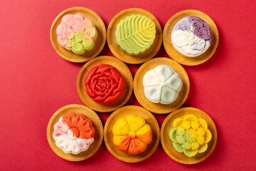 top view trendy different flower shapes mooncakes on red horizontal composition