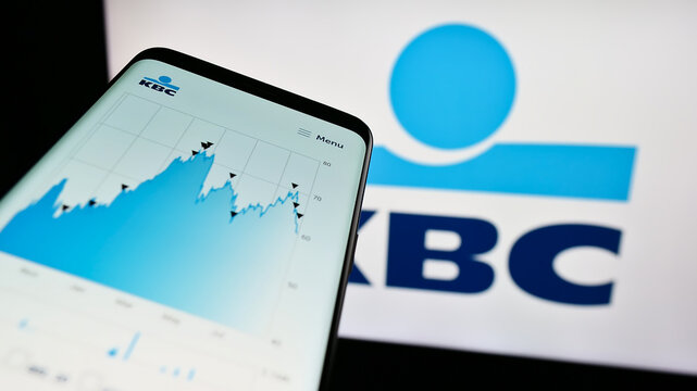 Stuttgart, Germany - 08-26-2023: Smartphone with webpage of Belgian financial company KBC Group N.V.  on screen in front of business logo. Focus on top-left of phone display.