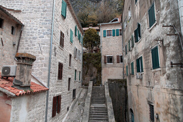 Fototapeta na wymiar Montenegro - Weathered residential buildings in Kotor Old Town