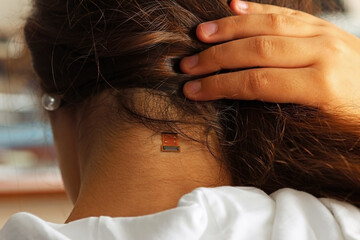 We are connected. Connection port on a woman's neck. Cyborg Woman Concept. Person with wearable technology