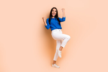 Full length photo of overjoyed lady wear stylish smart casual blue outfit rejoice black friday sale isolated on beige color background