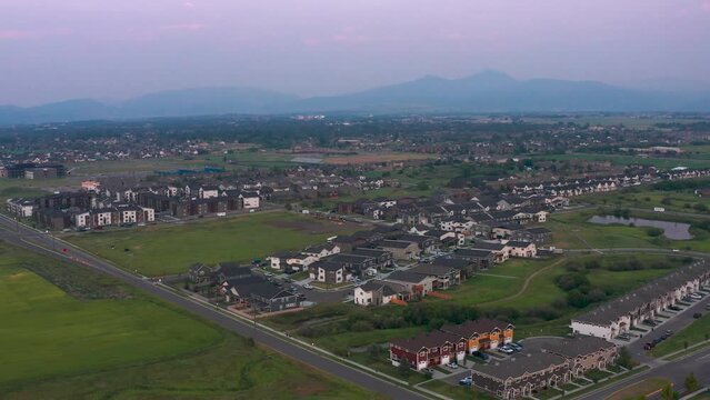 New rapid development suburban town home and apartments sprawl across bozeman montana, aerial pedestal