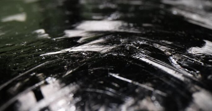 Canvas covered with chaotic reflective lines on dark premise. Abstract work symbolizing psychological instability with mental human problems