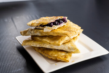 fried tortilla on a white plate. snack.food concept.