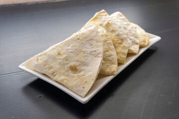 fried tortilla on a white plate. snack.food concept.