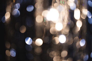 White and blue bokeh lights with copy space on dark background