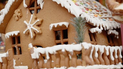Large gingerbread house decorated for Christmas. Close-up view.
