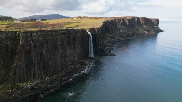 Drone panning shot of the high mealt falls in Scotland on a sunny day.