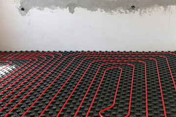 Water underfloor heating systems installation, work in progress on construction site for a flat...