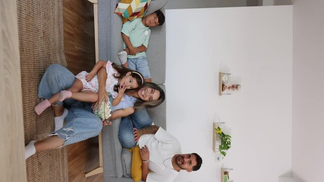 latin american family with children happy at home on the sofa living room