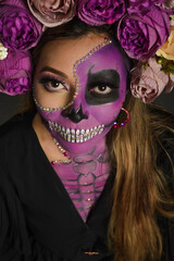 Santa Muerte, day of the dead character. Portrait of a woman with sugar skull makeup. Halloween make-up. Portrait of Calavera Catrina