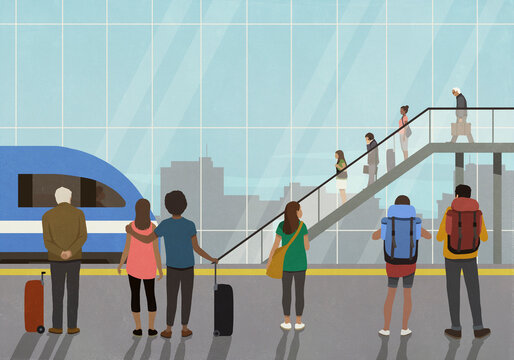 Passengers standing and waiting in train station
