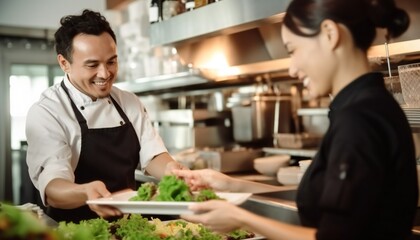 Male and female staff serving food at a restaurant