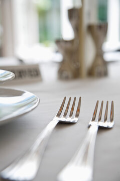 Extreme close up of tableware with forks
