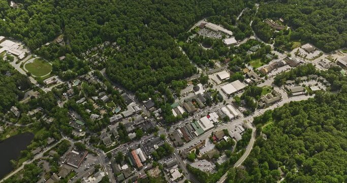 Highlands North Carolina Aerial v6 birds eye view drone flyover town center above main street, tilt up capturing lush mountainscape and hight altitude cloudscape - Shot with Mavic 3 Cine - July 2022