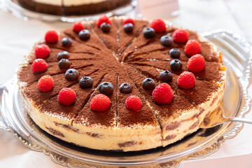 Tiramisu cake with raspberries  Traditional Italian dessert