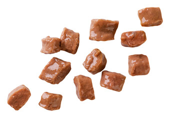 Cat food pieces fly close-up on a white background. Isolated