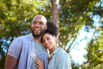 Obraz premium Portrait Of Loving Couple Standing Outdoors In Garden Park Or Countryside