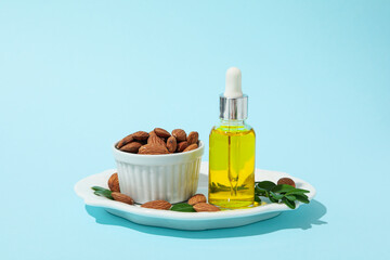 Skin care and body care concept - almonds, almond oil