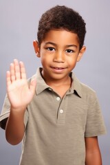 Obraz premium portrait of a cute young ethnic boy holding out his hand