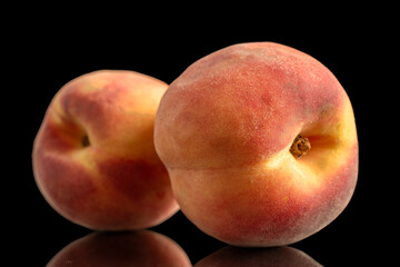 Two sweet juicy peaches, macro, isolated on white background.