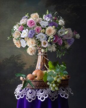 Still life with bouquet of flowers and fruits